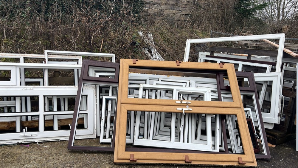 Mixed coloured and white uPVC frames at our collection yard — covering trade jobs across the North West, North Wales and Midlands