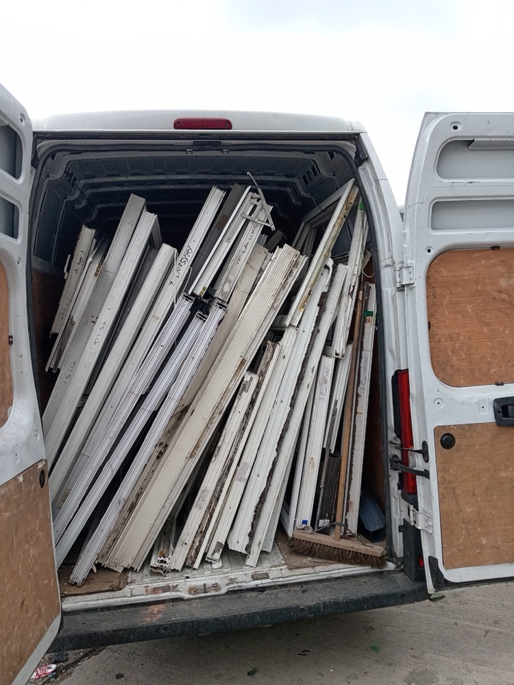 uPVC frames loaded into our free collection van — the alternative to skip hire